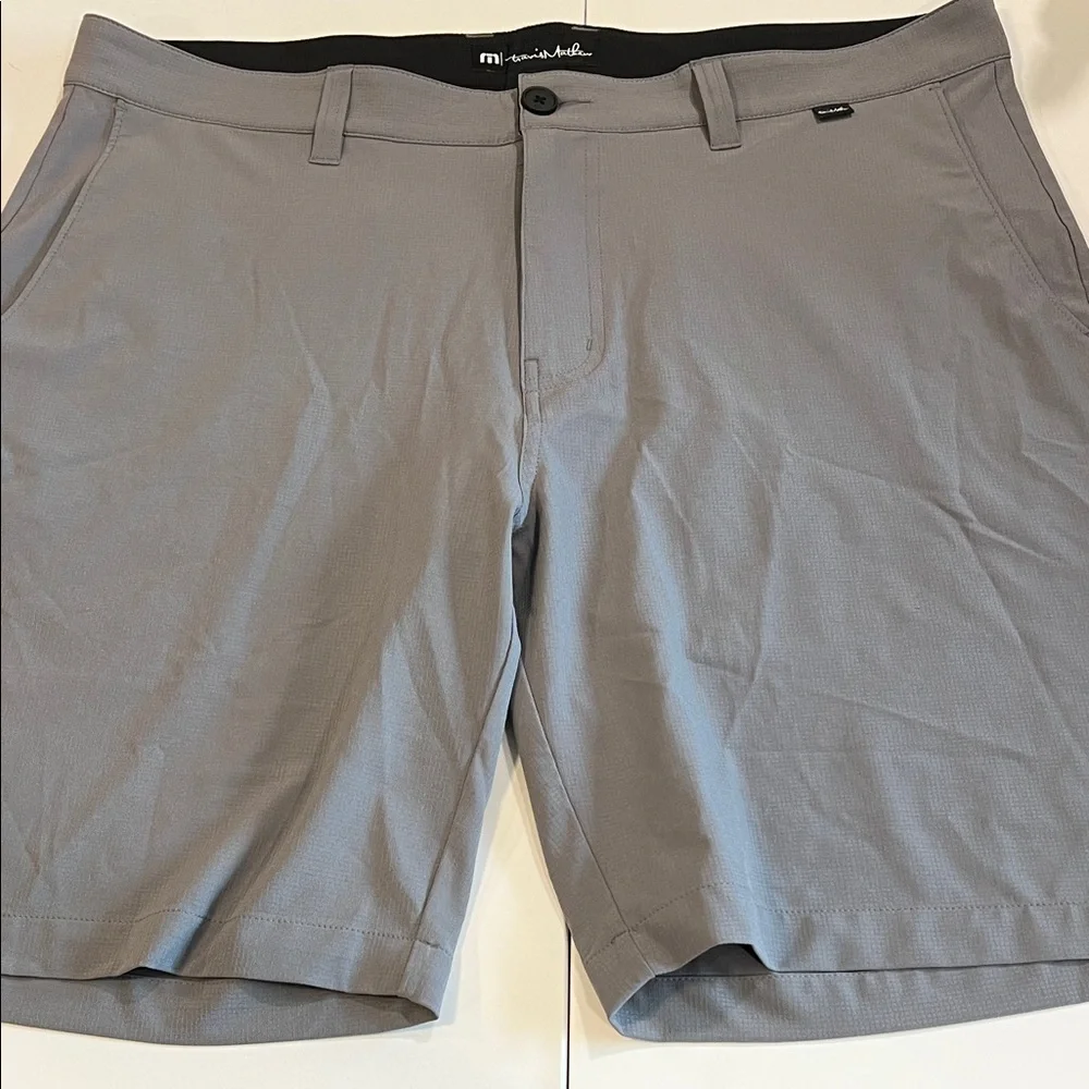 Travis Mathew - 38, light weight gray flat front‎ shorts